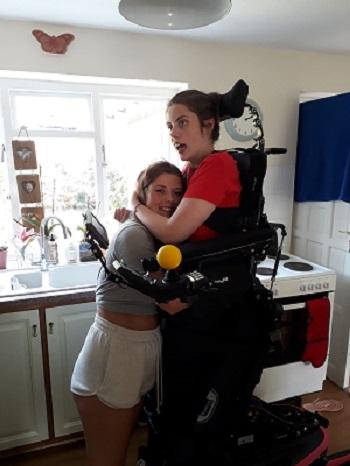 Floss with her sister at home in July 2021, two years after her accident
