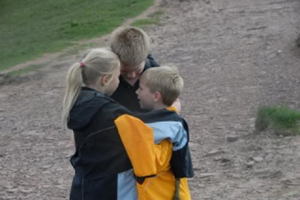 Chas: young siblings hugging