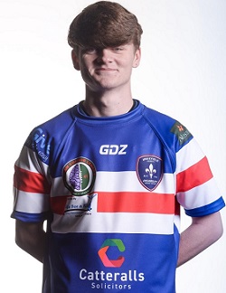 Connor: young man wearing rugby shirt smiling