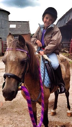 Daisy: young girl on a horse