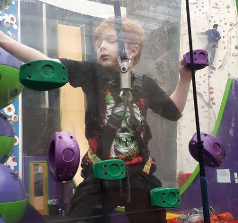 Harrison: young boy on a climbing wall