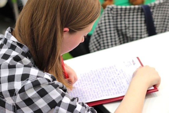 Teenager writing 