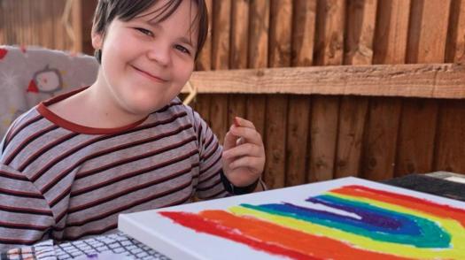 Joey painting rainbows