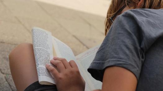 boy sat reading a book