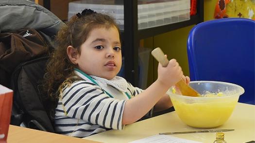 Shakeerah mixing a cake