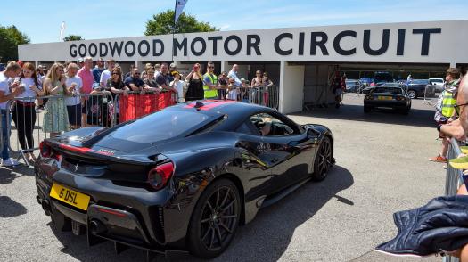 A Ferrari enters goodwood for The Children's Trust Supercar Event