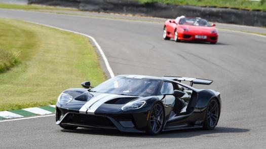 A car takes to the Goodwood track at the Supercar Event