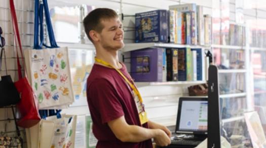 A laughing man in a charity shop