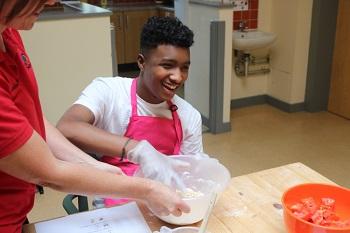 Jake cooking at The Children's Trust