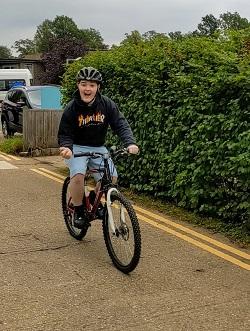 Spike riding his bike