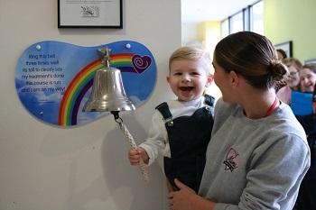 Arthur ringing the going home bell at The Children's Trust