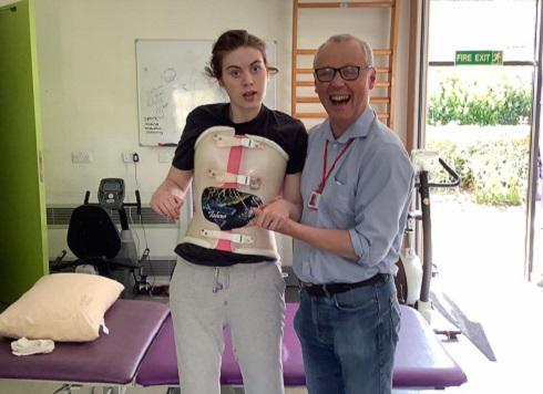 Floss standing next to her dad Robin at The Children's Trust