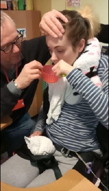 Robin feeding Floss at The Children's Trust in April 2020, 11 months after her accident