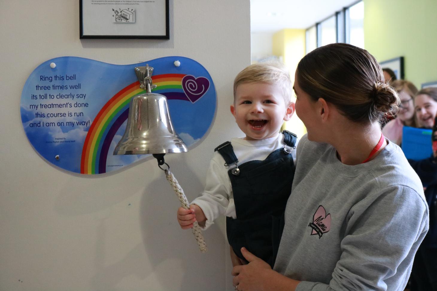 Arthur ringing the going home bell at The Children's Trust