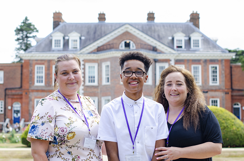 Tye stood with his family in front of The Children's Trust mansion