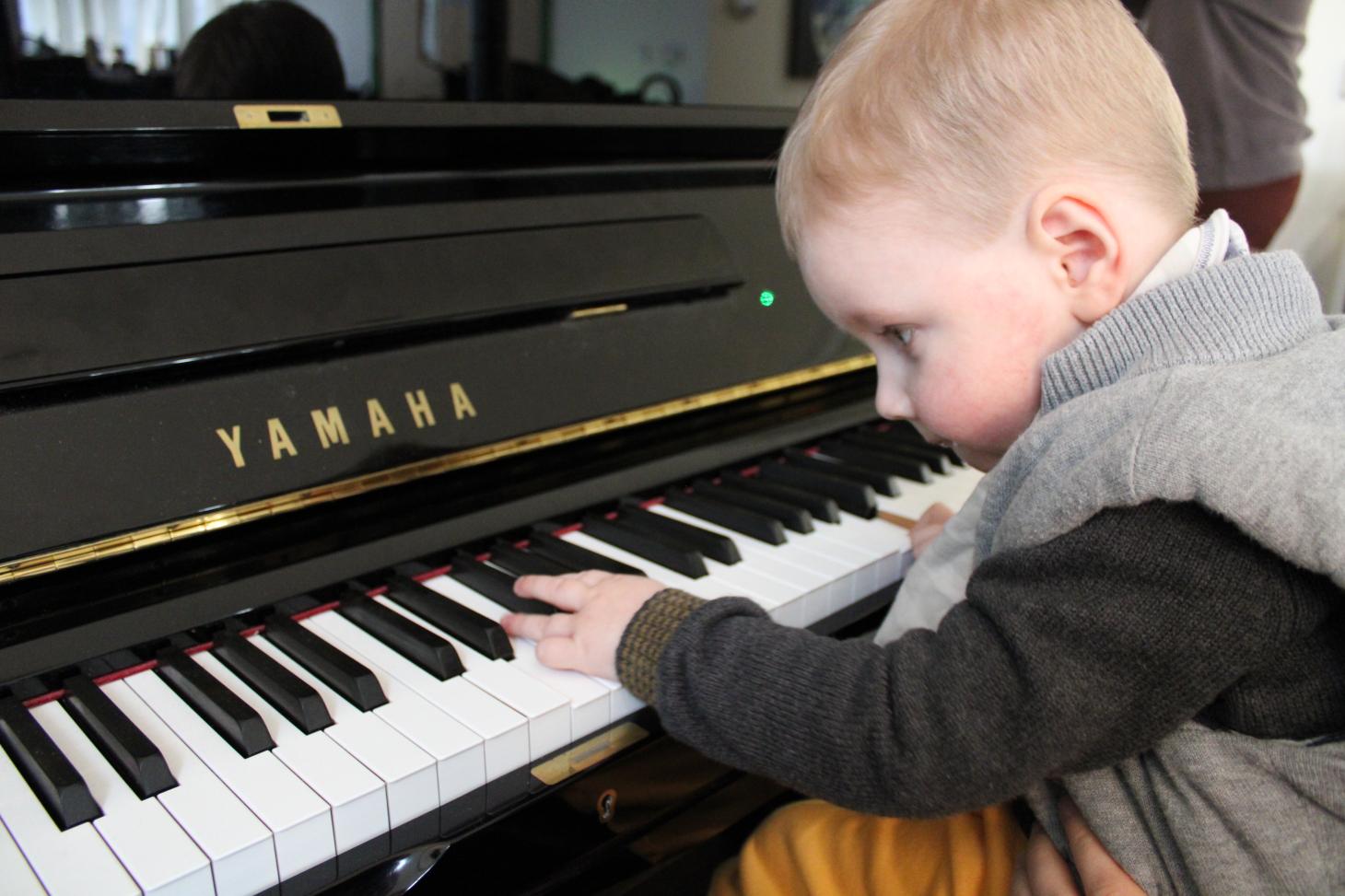 Finn playing on the piano