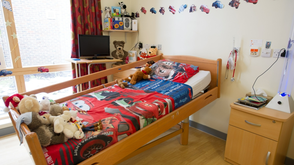 A bedroom within Camelia House