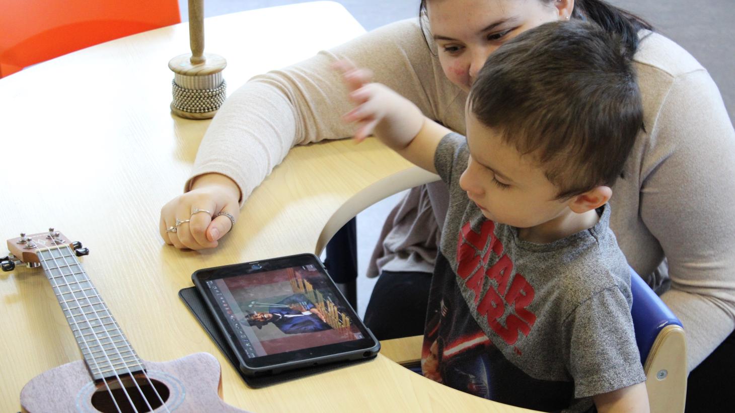 Matthew on a tablet during a music session