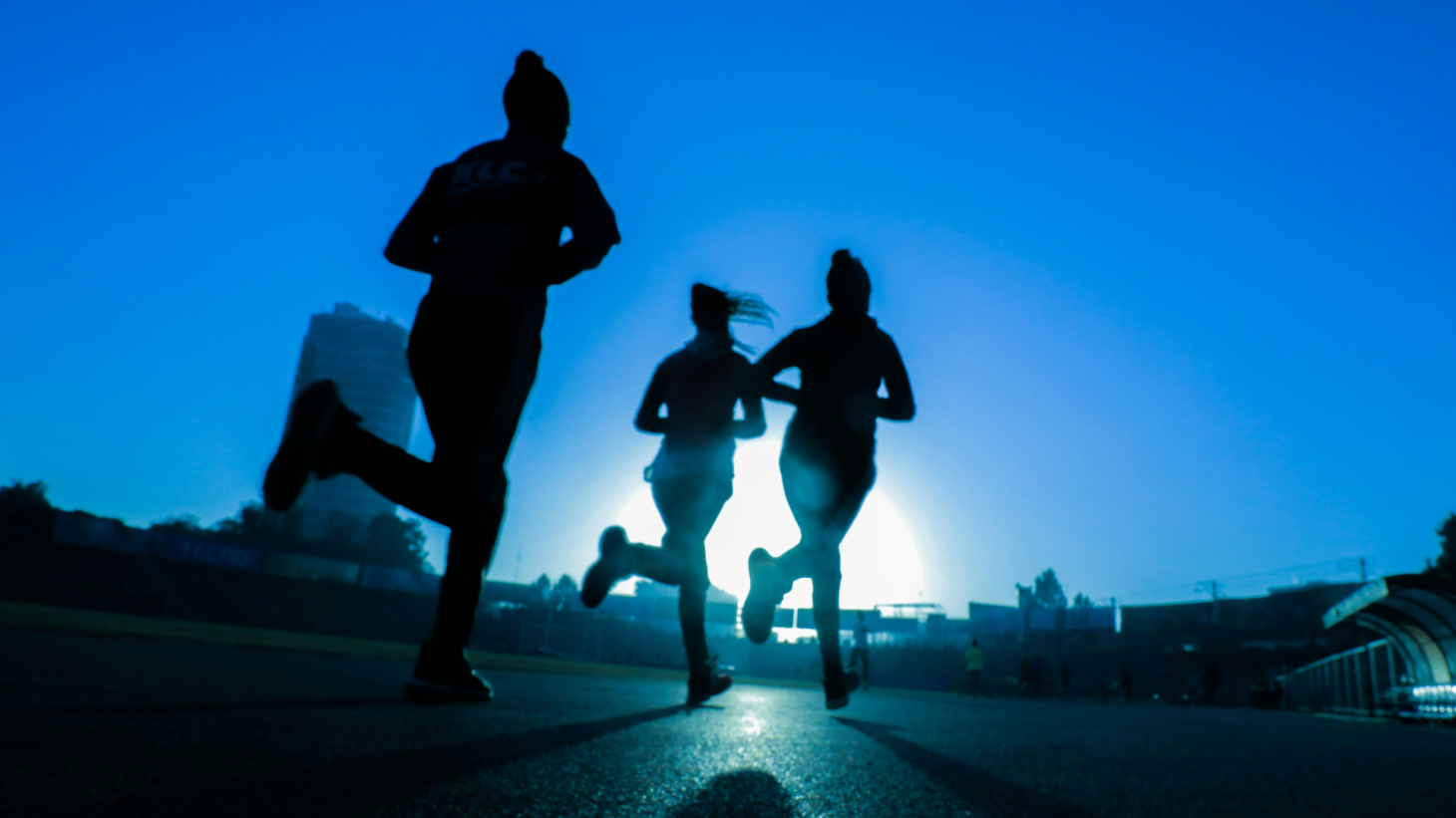 Runners running through the street.