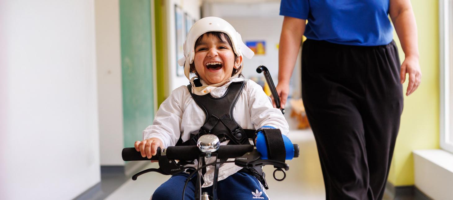 Siddique smiling whilst cycling