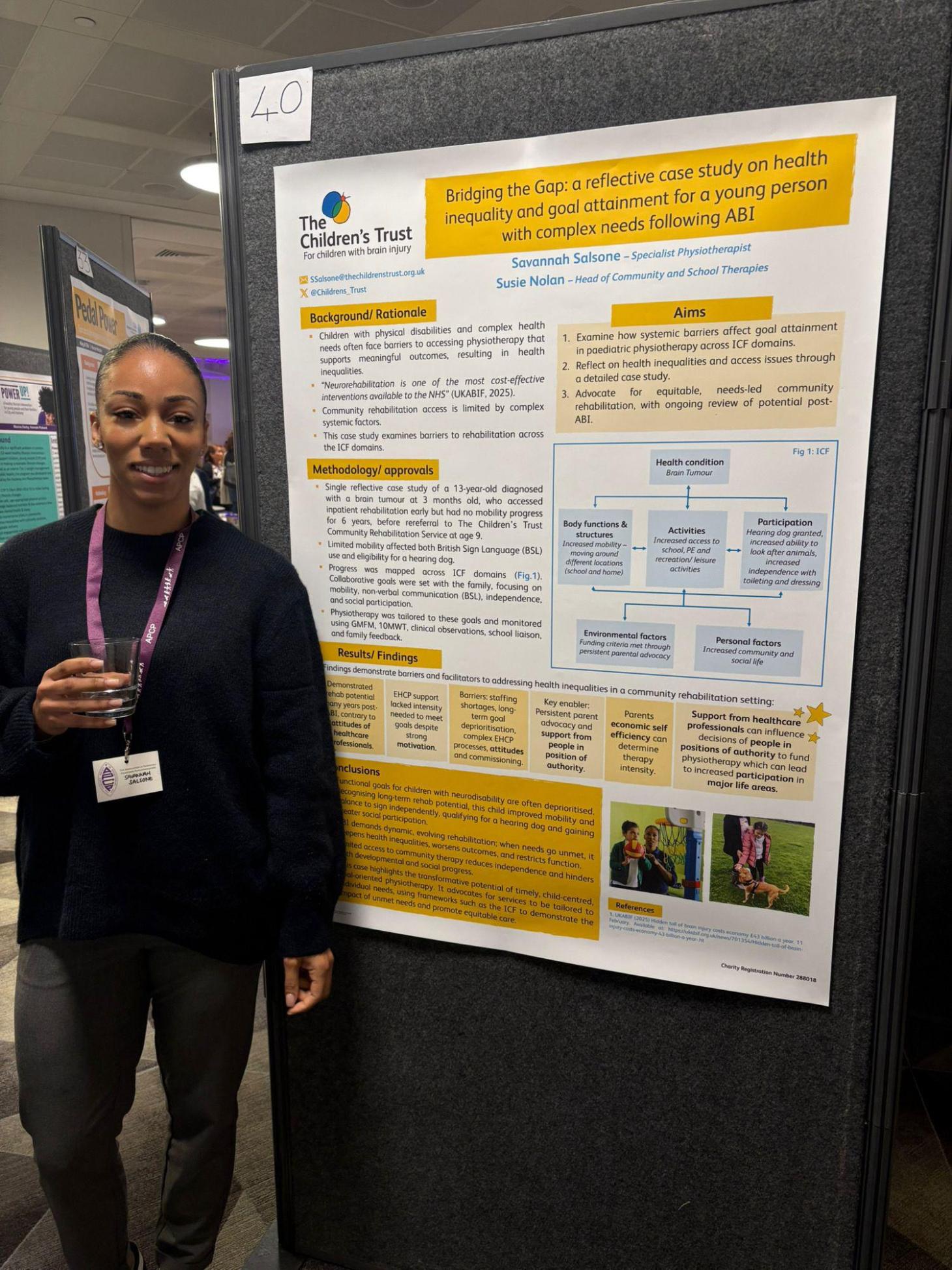 Staff member with conference poster