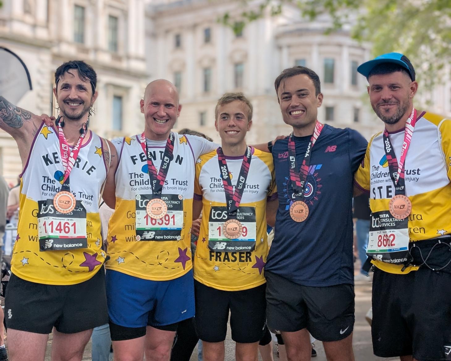 Runners with medals smiling