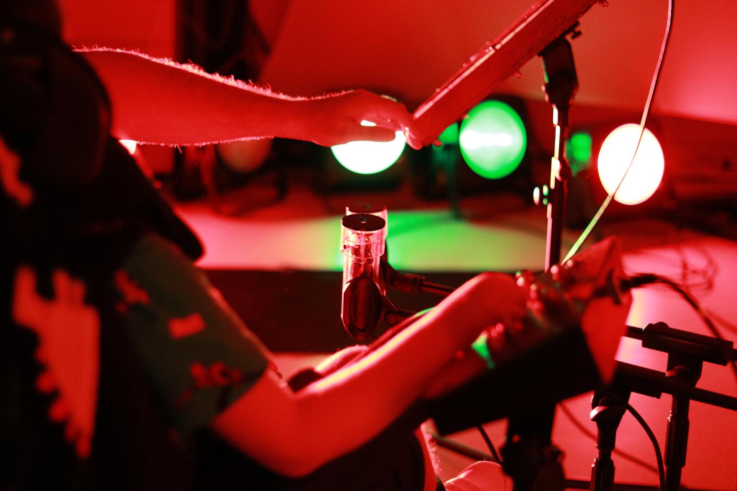 close up of child's hand using sensory music equipment