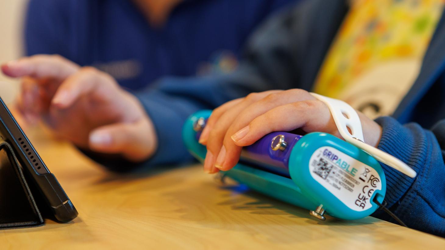 child using assistive tech controller 