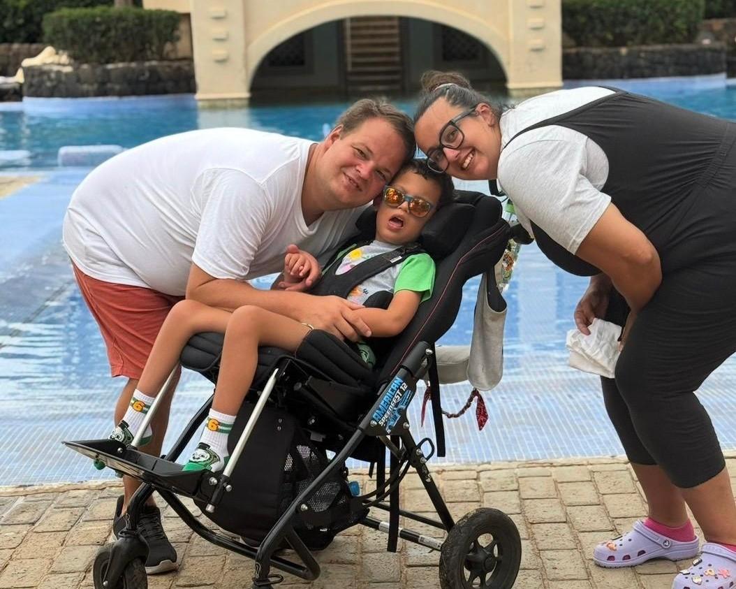 Seb and his parents on holiday