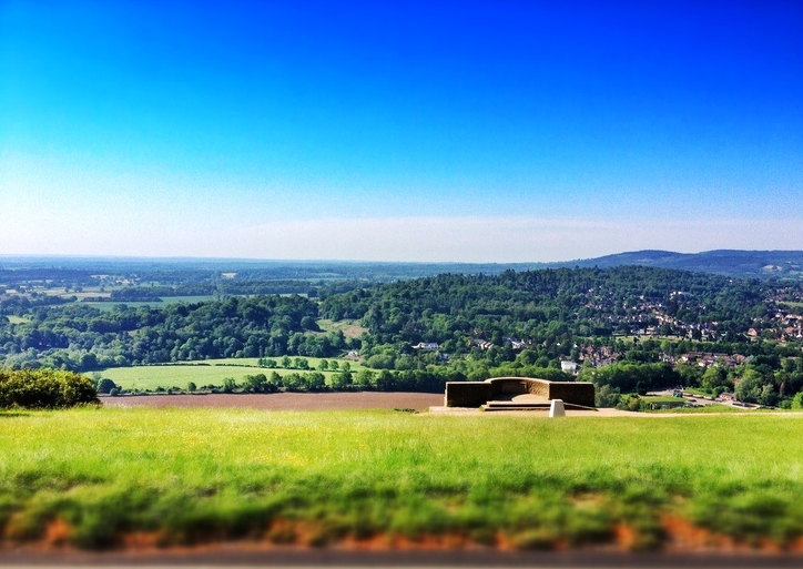 sprawling Surrey green hills from the ancient viewpoint at Box Hill set against Turquoise skies