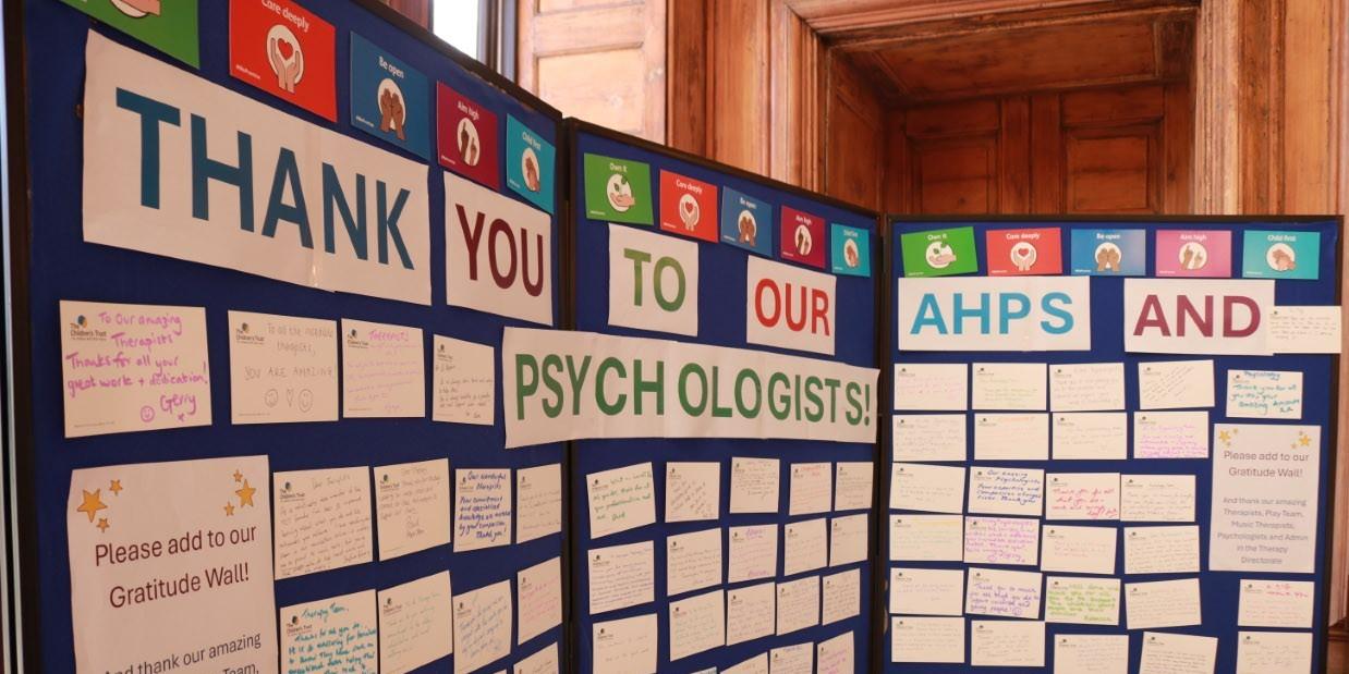 Blue notice board displaying messages of thanks for AHPs at The Children's Trust