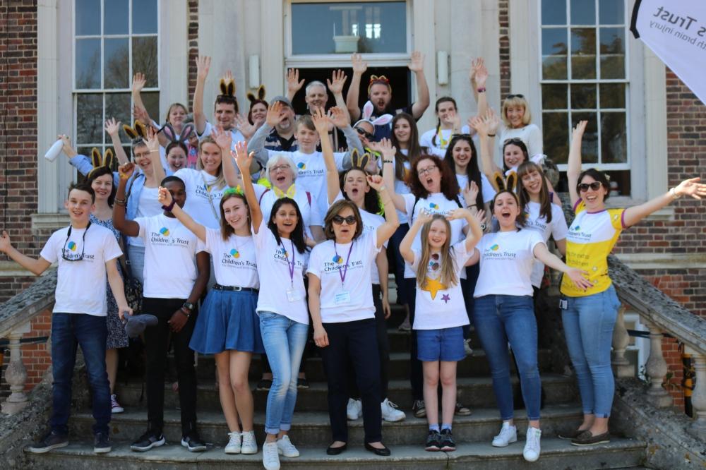 Group of volunteers outside the mansion