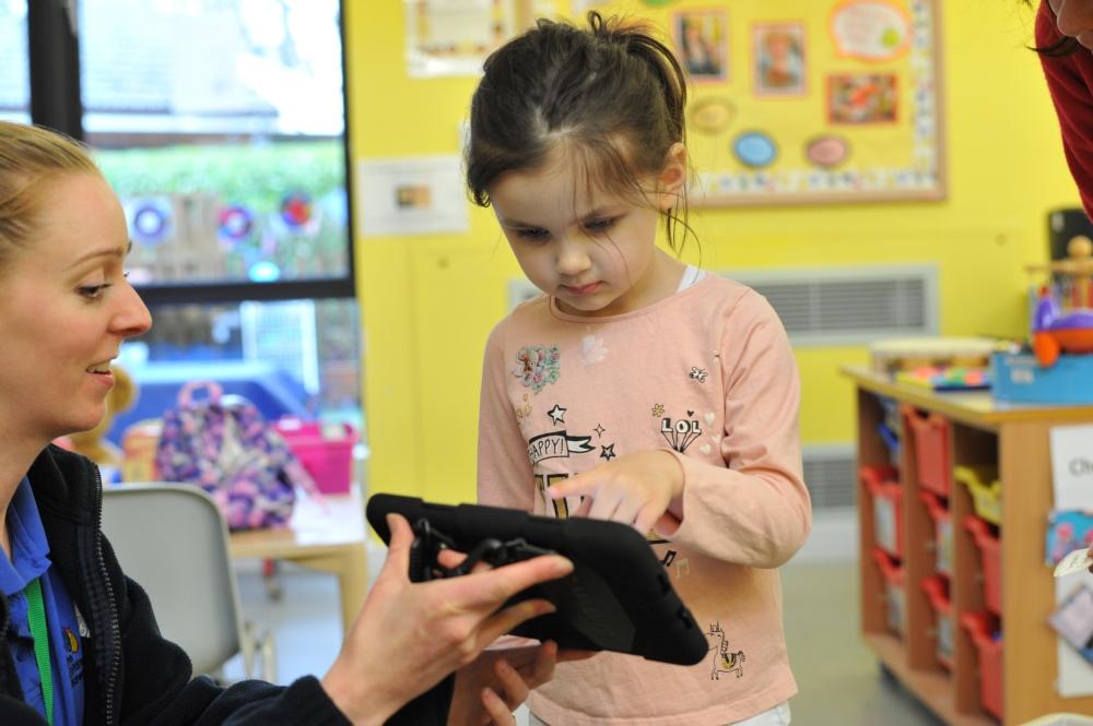 Mia at a speech therapy play session