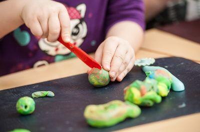 Child using play dough