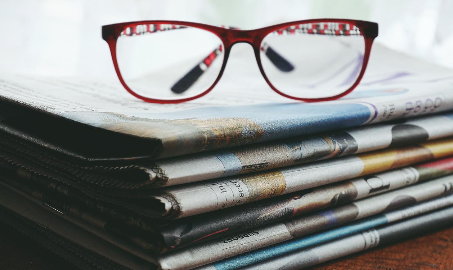 newspaper and glasses