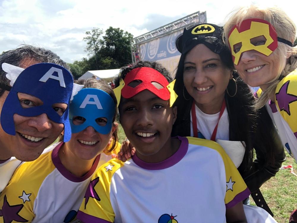 A team wearing superhero masks