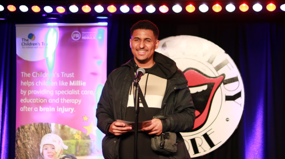 Zac speaking at The Comedy Night 2025