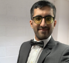 Saqlain stood wearing a bow tie