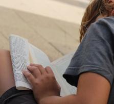 boy sat reading a book