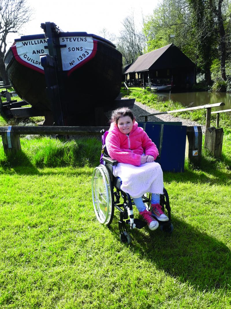 Chloe sat in her wheelchair