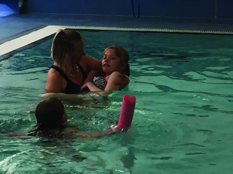 Emily and family in the pool