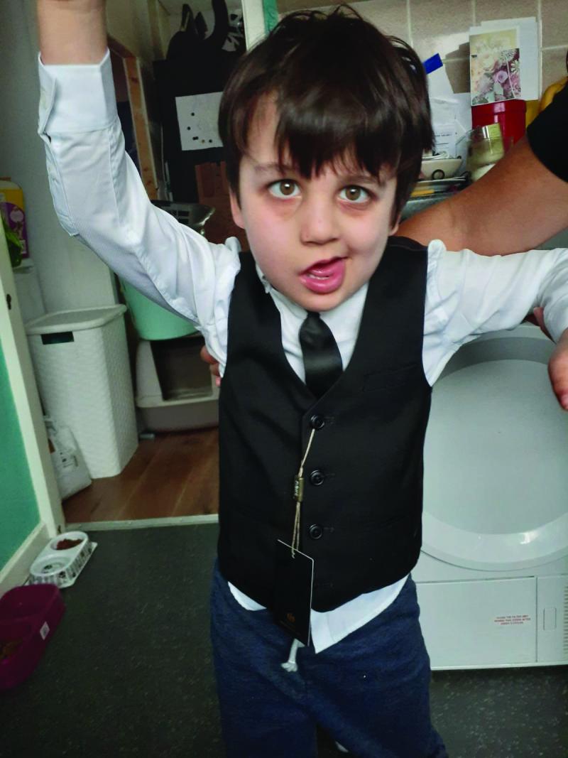 Jenson standing in his suit