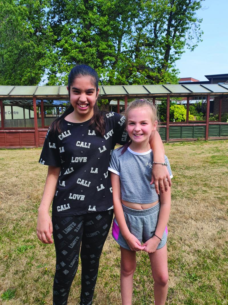 Lily and friend Dilpreet on Camelia House at The Children's Trust
