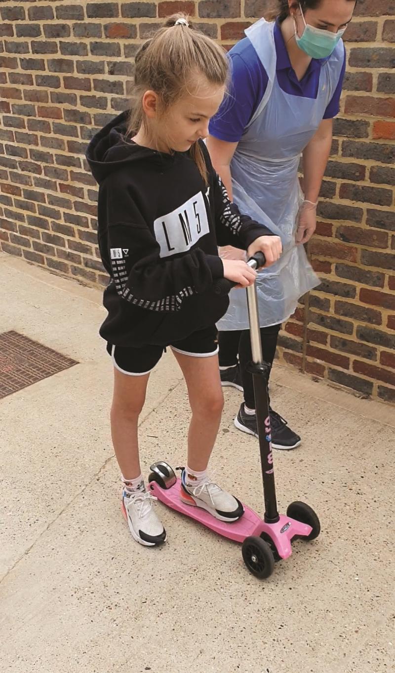 Lily on a scooter