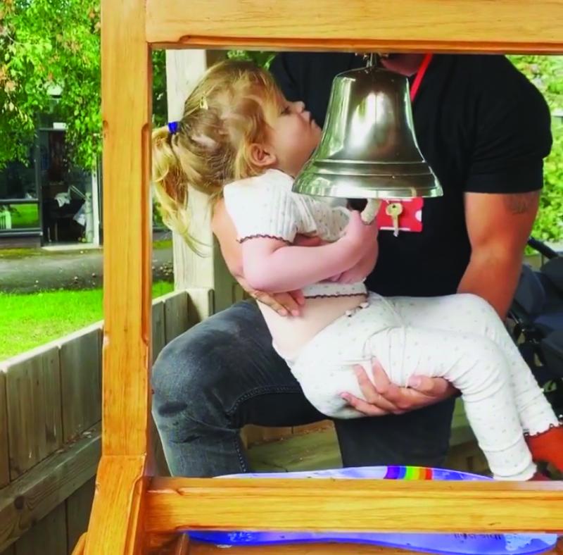 Mila ringing the going home bell