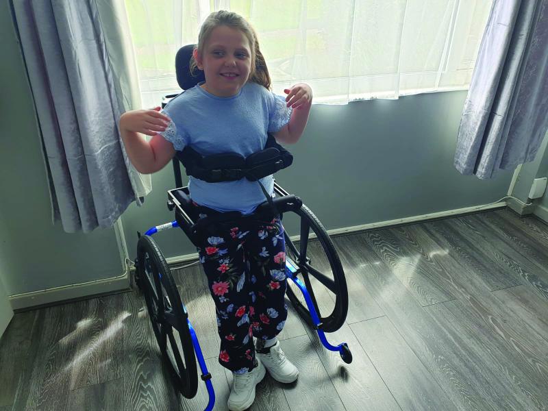 Millie in her standing frame