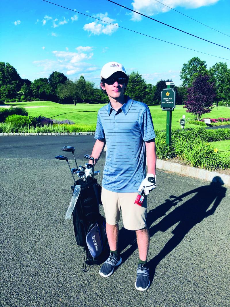 Tommy playing golf