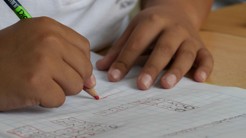 close up of child writing