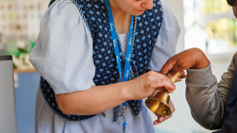Child ringing a bell