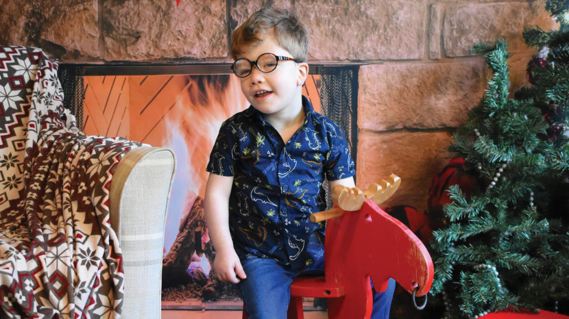 Teddie on a rocking horse at Christmas